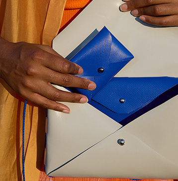 Cardholder held in hand, showing the card slot