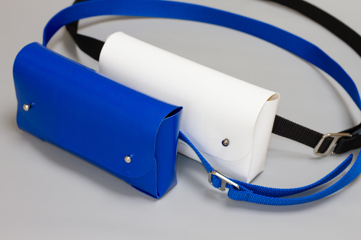 Tasket Fanny Pack in blue and white, shown together